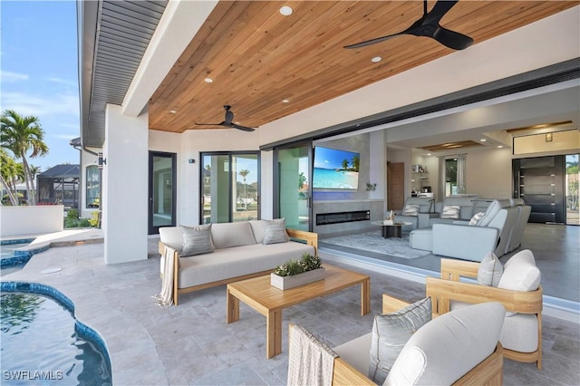 view of patio with an outdoor hangout area and ceiling fan