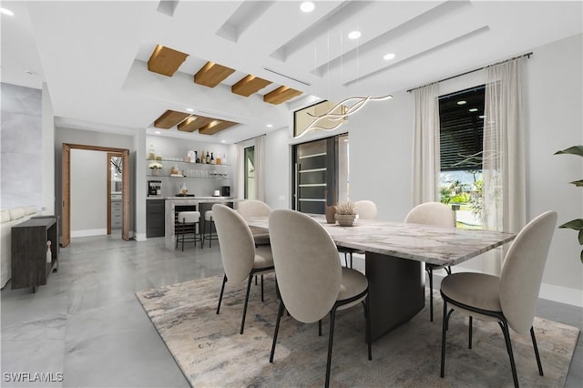 dining space featuring indoor bar