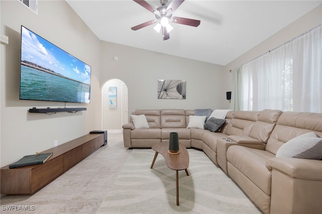 living room with ceiling fan and vaulted ceiling