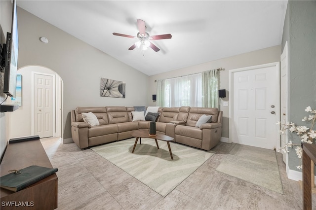 living room featuring ceiling fan and lofted ceiling