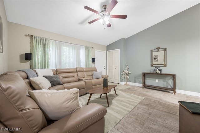 living room with ceiling fan and vaulted ceiling