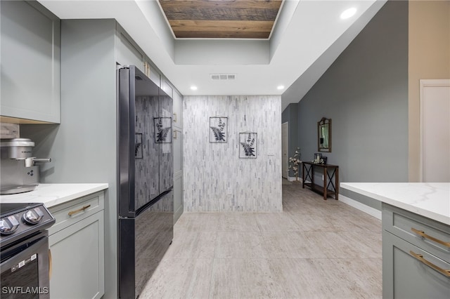 kitchen featuring wood ceiling, gray cabinetry, light stone counters, and black appliances