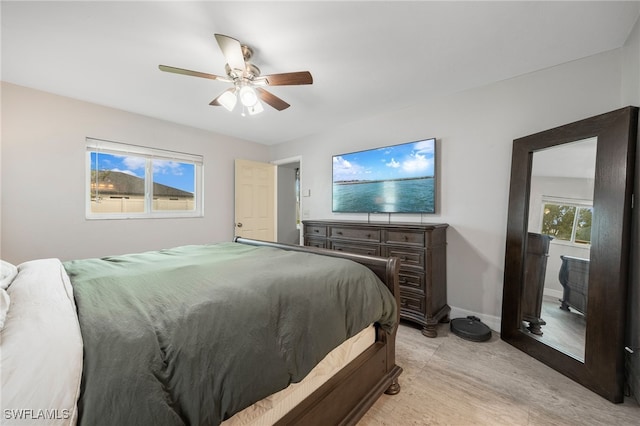 bedroom featuring ceiling fan and light hardwood / wood-style flooring