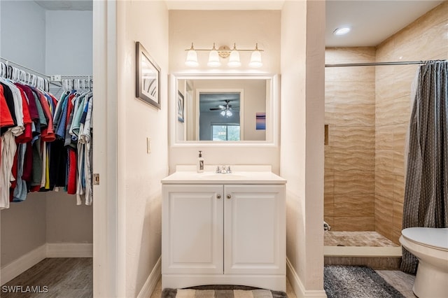 bathroom with a shower with curtain, vanity, toilet, and wood-type flooring