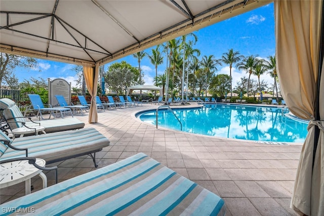 view of pool featuring a gazebo and a patio