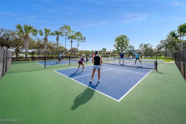 view of sport court featuring basketball hoop