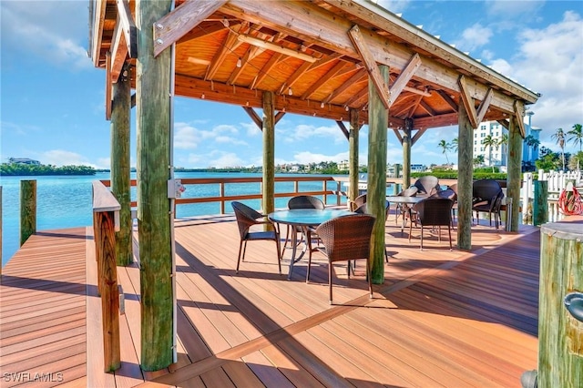 view of dock featuring a gazebo and a water view