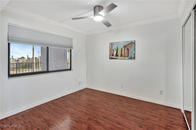 unfurnished room with dark hardwood / wood-style floors, ceiling fan, and ornamental molding