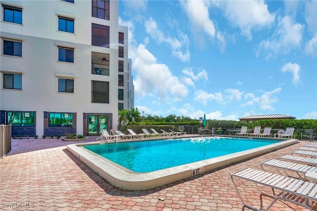 view of swimming pool with a patio