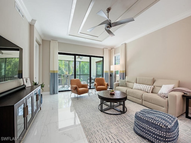 living room featuring ceiling fan and ornamental molding