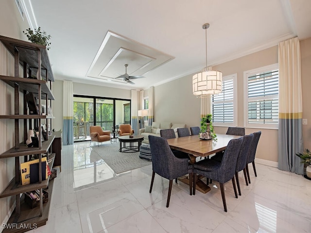 dining space featuring ceiling fan with notable chandelier and crown molding