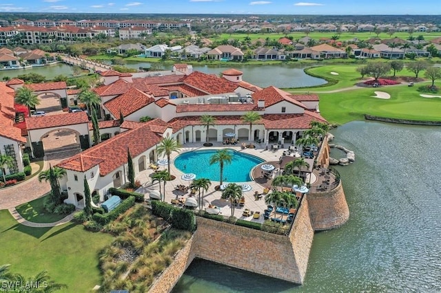 birds eye view of property with a water view