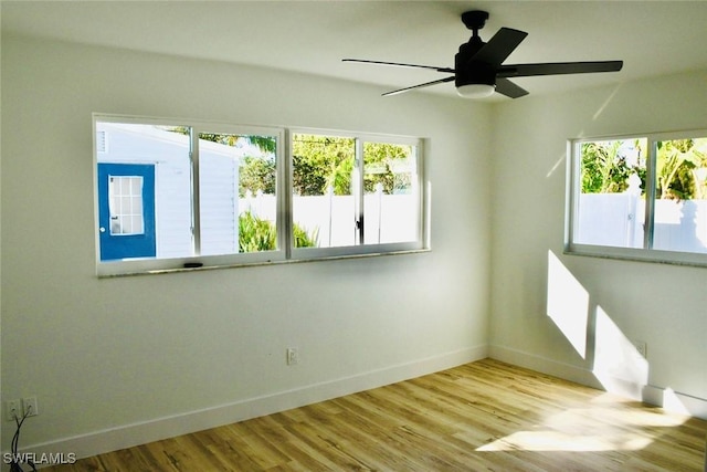 spare room with ceiling fan and light hardwood / wood-style floors