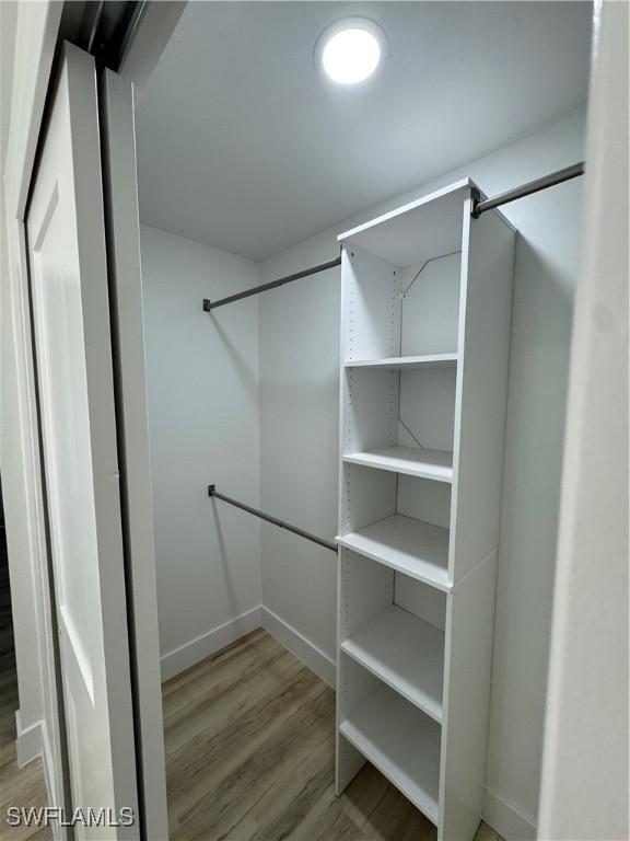 spacious closet featuring wood-type flooring