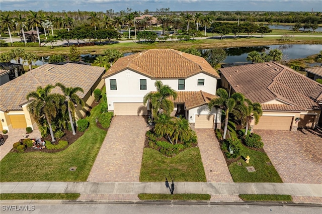 birds eye view of property with a water view