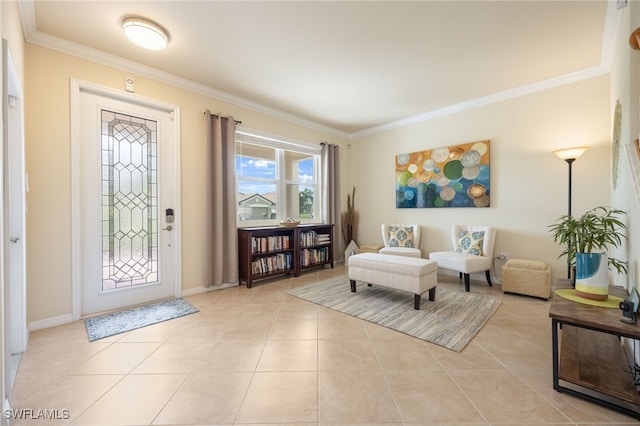 tiled foyer featuring ornamental molding