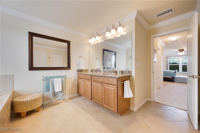 bathroom featuring ceiling fan, tile patterned flooring, vanity, and ornamental molding