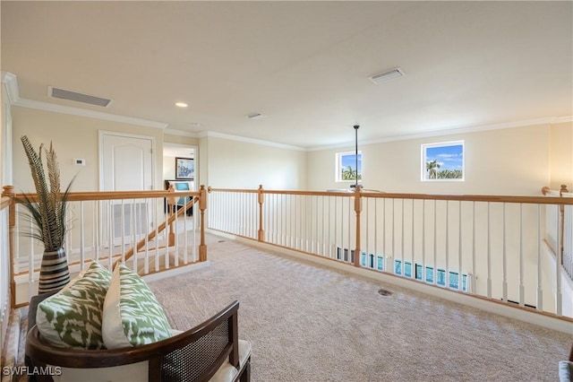 sitting room featuring carpet flooring and ornamental molding