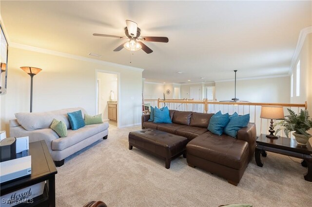 living room with crown molding, ceiling fan, and light carpet