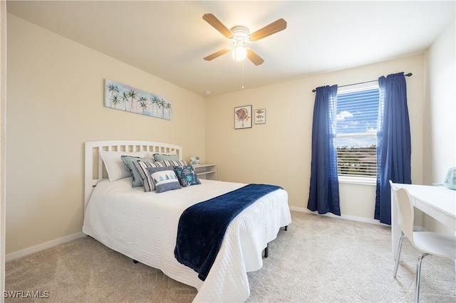 bedroom featuring ceiling fan and light carpet