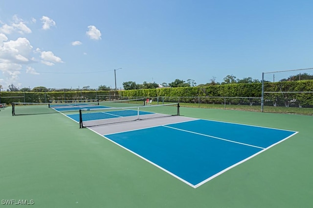 view of sport court with fence