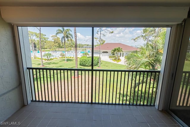 exterior space featuring tile patterned floors and plenty of natural light