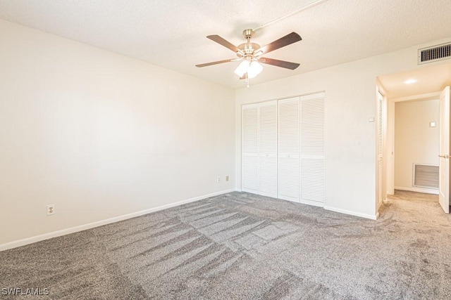 unfurnished bedroom with visible vents, baseboards, and carpet floors