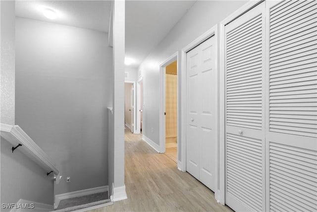 hallway with light wood-type flooring