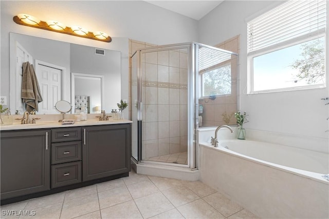 bathroom with vanity, tile patterned flooring, and shower with separate bathtub