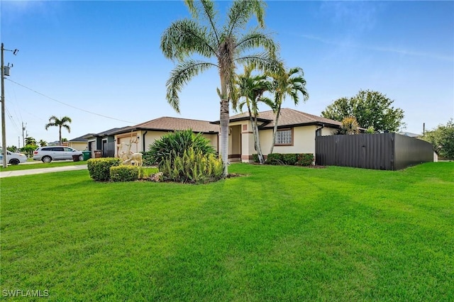 single story home featuring a front yard