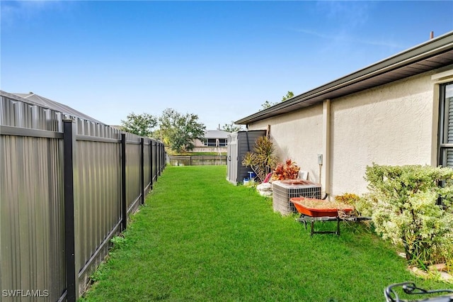 view of yard with central air condition unit