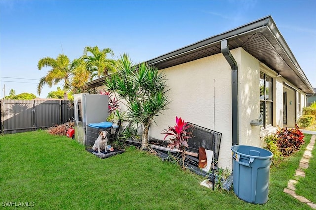 view of side of property featuring a yard