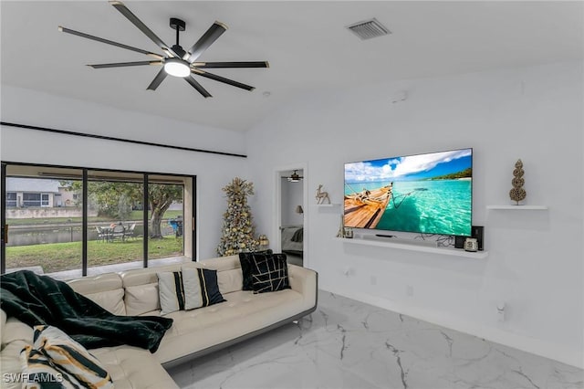 living room featuring ceiling fan and lofted ceiling