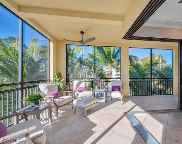 sunroom with a healthy amount of sunlight and ceiling fan