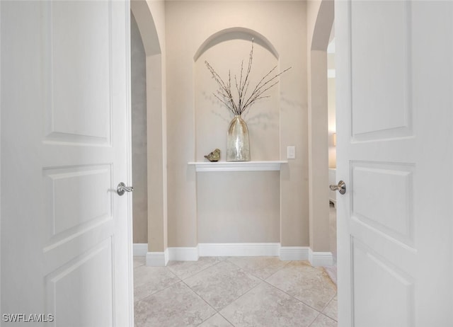 bathroom with tile patterned flooring and baseboards