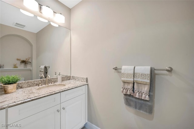 bathroom featuring vanity and visible vents