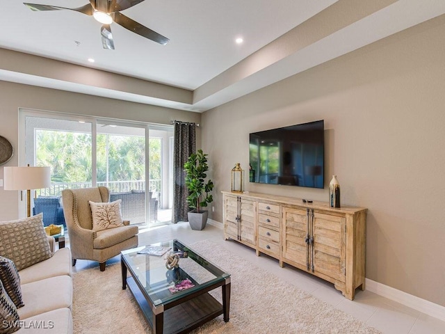 living room with ceiling fan and light tile patterned flooring