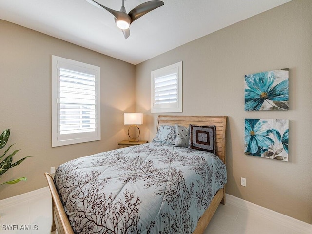 bedroom featuring ceiling fan and multiple windows