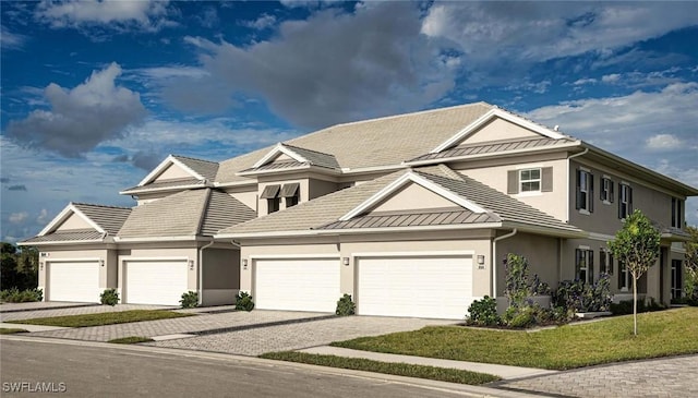 view of front facade with a front yard and a garage