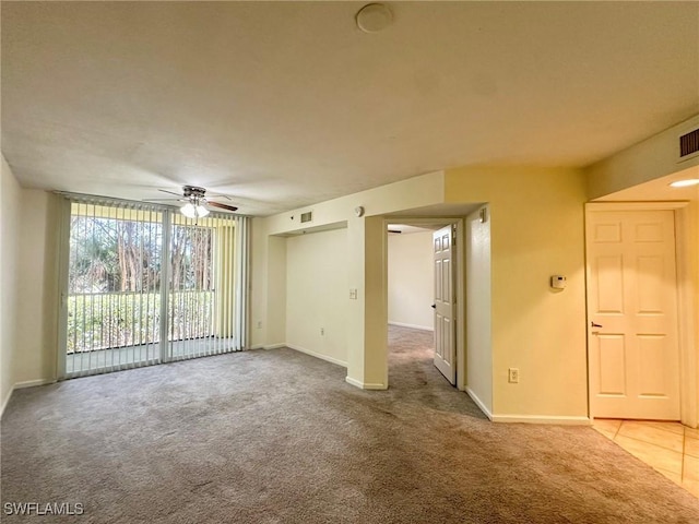 spare room with carpet flooring and ceiling fan