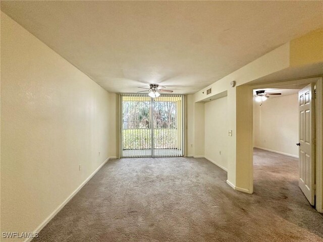 spare room with carpet floors and ceiling fan