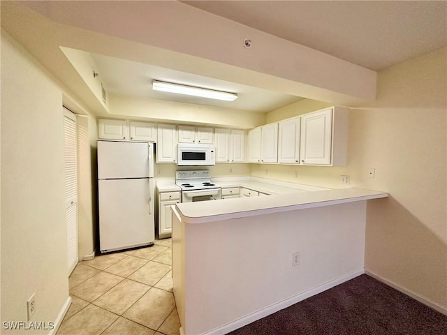 kitchen featuring kitchen peninsula, light tile patterned floors, white appliances, and white cabinetry