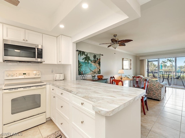 kitchen with white cabinetry, ceiling fan, white electric range oven, kitchen peninsula, and light tile patterned floors