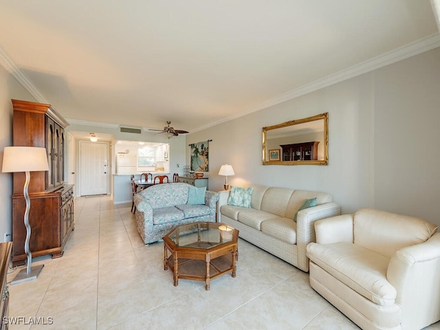 living room with ceiling fan, light tile patterned floors, and ornamental molding