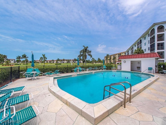 view of swimming pool with a patio