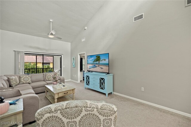 living room featuring light carpet, high vaulted ceiling, and ceiling fan