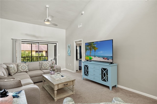 carpeted living room featuring high vaulted ceiling and ceiling fan