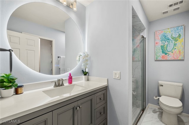 bathroom with vanity, toilet, and a shower with door