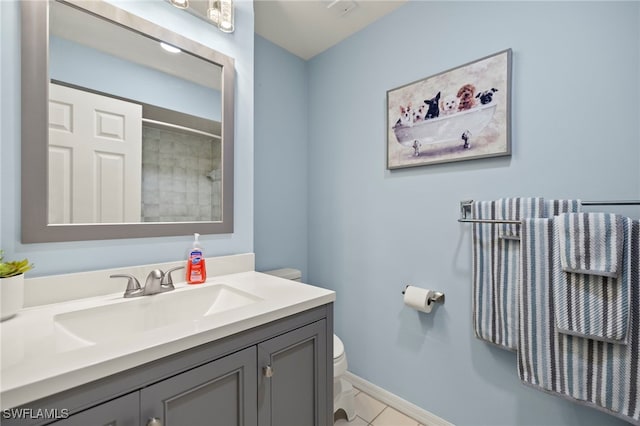 bathroom featuring tile patterned floors, walk in shower, vanity, and toilet