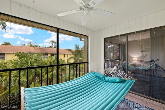 sunroom / solarium with ceiling fan